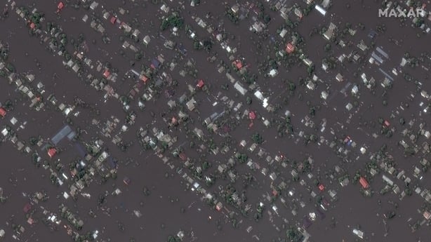 A satellite image shows flooded homes in Ukraine