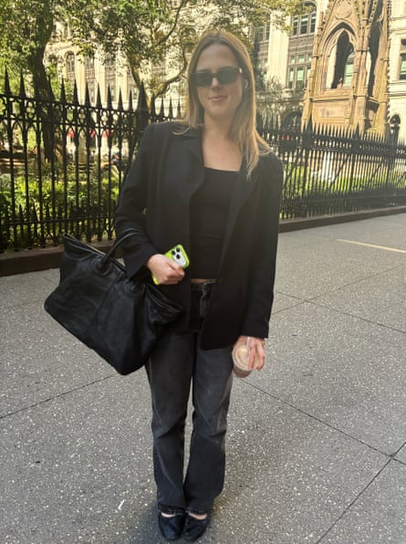 a woman in a black blazer