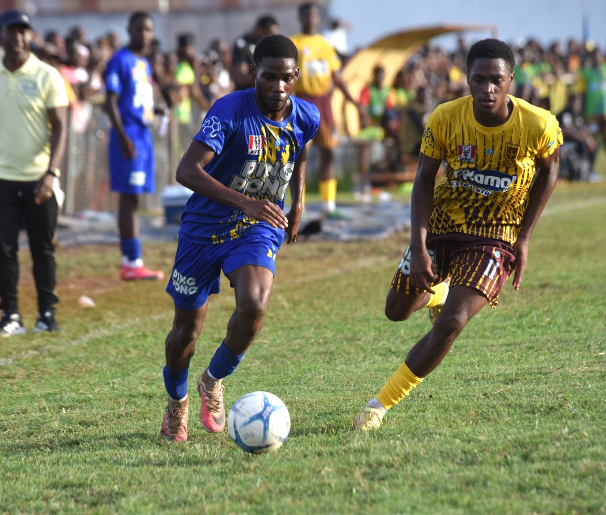Clarendon College's Patrick Page (left) tries to outrun Manchester High’s Brandon Brown during their ISSA Ben Francis KO quarterfinal match at Manchester High's playing field on Saturday, October 3, 2026.