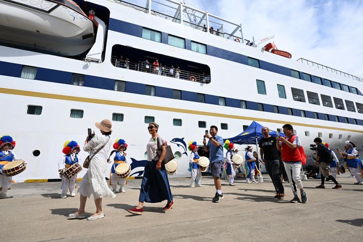 A group of Chinese tourists arrives by ferry at a cruise port on Jeju Island, Aug. 31, 2023. Joint Press Corps